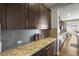 Kitchen features granite countertops, tile backsplash, and dark cabinets at 13979 Night Owl Ln, Parker, CO 80134