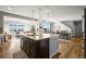 Open concept kitchen flows seamlessly into dining and living area at 13979 Night Owl Ln, Parker, CO 80134