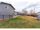 Large backyard with a patio and a playset, perfect for enjoying outdoor activities at 2136 S Balsam Ct, Lakewood, CO 80227