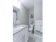 Bright bathroom featuring a granite countertop sink and well-lit vanity at 2136 S Balsam Ct, Lakewood, CO 80227
