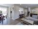 Spacious living area with hardwood floors, leading to an open kitchen, dining area, and stairway at 2136 S Balsam Ct, Lakewood, CO 80227
