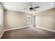 Carpeted bedroom with neutral paint and a ceiling fan at 3450 Valentia St, Denver, CO 80238