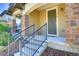 Inviting front porch with decorative columns and a well-maintained entrance; shows unit number at 3450 Valentia St, Denver, CO 80238