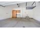 Spacious two car garage with gray epoxy floor and built-in cabinets at 3450 Valentia St, Denver, CO 80238