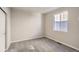 This bedroom features neutral carpet and a window at 14120 Bunny Hop Ln, Parker, CO 80134