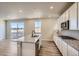 Bright kitchen features granite counters, an island with sink, and stainless steel appliances at 14120 Bunny Hop Ln, Parker, CO 80134