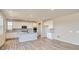 Modern kitchen with white cabinets, stainless steel appliances, an island, and hard surface floors at 14120 Bunny Hop Ln, Parker, CO 80134