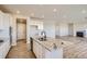 Modern kitchen featuring a granite island, stainless steel appliances, and an open floorplan at 14120 Bunny Hop Ln, Parker, CO 80134