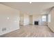 Living room showcasing hard surface floors, a fireplace, and ample natural light at 14120 Bunny Hop Ln, Parker, CO 80134