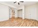 Bedroom with wood flooring and open doorway into the large open basement area at 42299 Kingsmill Cir, Elizabeth, CO 80107