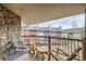 Relax on this cozy balcony with wooden rocking chairs and a view of the surrounding neighborhood at 325 Four O Clock Rd # 303, Breckenridge, CO 80424