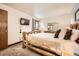 Relaxing bedroom with mounted TV, natural wood accents, and plush carpeting at 325 Four O Clock Rd # 303, Breckenridge, CO 80424