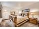 Comfortable bedroom with a unique log bed frame and cozy neutral decor at 325 Four O Clock Rd # 303, Breckenridge, CO 80424