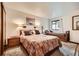 Cozy bedroom with two beds, soft carpet, and warm lighting at 325 Four O Clock Rd # 303, Breckenridge, CO 80424
