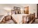 Inviting bedroom with log furniture, soft lighting, and warm, cozy atmosphere at 325 Four O Clock Rd # 303, Breckenridge, CO 80424