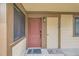 Condominium entrance with neutral toned siding, two welcome mats and a dark-stained door with hardware at 325 Four O Clock Rd # 303, Breckenridge, CO 80424