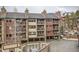 View of the attractive multi-story building with balconies and convenient covered parking at 325 Four O Clock Rd # 303, Breckenridge, CO 80424