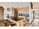 Kitchen with wooden cabinets, a black granite countertop island, and stainless steel appliances at 325 Four O Clock Rd # 303, Breckenridge, CO 80424