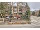 Park Place Condominiums: Attractive signage at community entrance by landscaped garden and mountains at 325 Four O Clock Rd # 303, Breckenridge, CO 80424