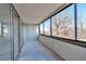 Enclosed balcony space featuring large windows, brick accents, and ample natural light at 1850 Folsom St # 411, Boulder, CO 80302