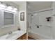 Bathroom featuring a vanity with mirror and a bathtub with white tile surround at 1850 Folsom St # 411, Boulder, CO 80302