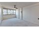Bedroom featuring a ceiling fan and large windows with natural light at 1850 Folsom St # 411, Boulder, CO 80302