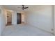Bedroom with a ceiling fan, carpet and a walk in closet at 1850 Folsom St # 411, Boulder, CO 80302