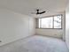 Bedroom with a ceiling fan and large window with natural light and carpet at 1850 Folsom St # 411, Boulder, CO 80302