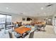 Spacious common area featuring ample seating, tables, large screen television, and convenient exit access at 1850 Folsom St # 411, Boulder, CO 80302