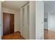 Hallway area with wood flooring, closet for storage, and white walls for a modern feel at 1850 Folsom St # 411, Boulder, CO 80302