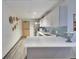 Shared kitchenette with modern appliances, ample storage, and eat-in counter at 1850 Folsom St # 411, Boulder, CO 80302