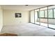 Living room featuring a large sliding glass door and neutral carpet at 1850 Folsom St # 411, Boulder, CO 80302
