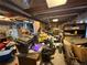 Unfinished basement with exposed pipes and filled with assorted items at 14874 E 52Nd Ave, Denver, CO 80239