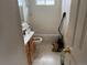 View of a cluttered bathroom with a toilet, sink, and shower/tub combination at 14874 E 52Nd Ave, Denver, CO 80239