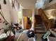 Foyer with a staircase and visible entry to the bathroom and living room at 14874 E 52Nd Ave, Denver, CO 80239