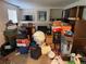 Living room filled with boxes and various items, obscuring the fireplace at 14874 E 52Nd Ave, Denver, CO 80239