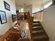 Carpeted staircase leading to an upper level, showing untidy areas at 14874 E 52Nd Ave, Denver, CO 80239
