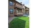 Exterior view of the building with private balconies and well-maintained landscaping at 7000 W 20Th Ave # 106, Lakewood, CO 80214