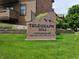 Telegraph Hill Condominiums sign surrounded by manicured lawn and building exterior at 7000 W 20Th Ave # 106, Lakewood, CO 80214