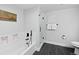 Bright bathroom with modern black fixtures, shower, soaker tub, and stylish gray tile floors at 2506 16Th St, Denver, CO 80211