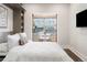 Bright bedroom featuring a cozy dining nook with city views and built-in shelving at 2506 16Th St, Denver, CO 80211