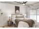 Cozy bedroom with exposed industrial ceiling, large windows, soft lighting, and neutral decor at 2506 16Th St, Denver, CO 80211
