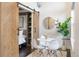 Charming dining area with barn door to bedroom and open space with a table, chairs and modern decor at 2506 16Th St, Denver, CO 80211