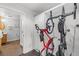 Hallway with bike rack and closet space, with a view to the bathroom at 2506 16Th St, Denver, CO 80211