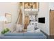 Open-concept living space with modern furnishings, high ceilings, and access to a kitchen and loft area at 2506 16Th St, Denver, CO 80211