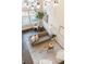 Bright living room featuring hardwood floors, tall ceilings, and a modern decorative chess set at 2506 16Th St, Denver, CO 80211