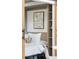 Murphy bed and storage shelves in room with art work and decorative pillow at 2506 16Th St, Denver, CO 80211