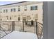 Private balcony overlooks the complex and snowy landscape at 4060 W 16Th Ave, Denver, CO 80204