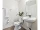 Clean and modern bathroom with a toilet and pedestal sink at 4060 W 16Th Ave, Denver, CO 80204