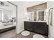 Modern bathroom with double vanity, large shower, and view of bedroom at 4060 W 16Th Ave, Denver, CO 80204